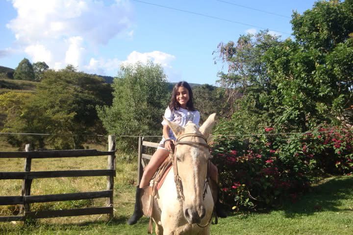 Lara riding a horse in Brazil